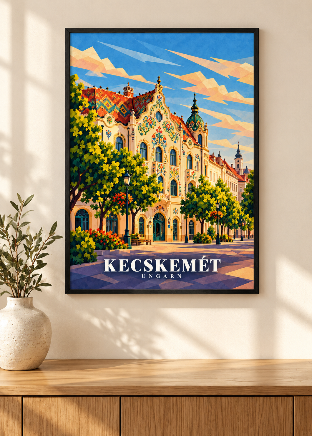 Kecskemét-Reiseplakat im schwarzen Rahmen an einer Wand